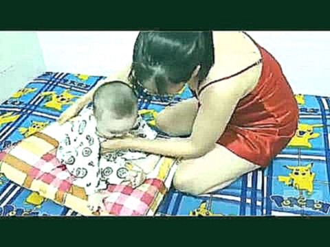 Breastfeeding and playing with baby Thinh 